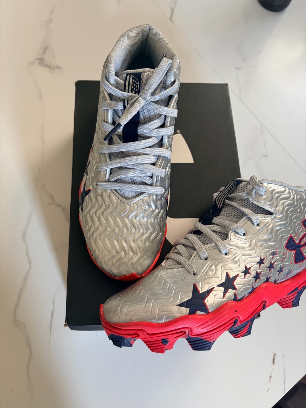 Kids Silver and Red Under Armour Cleats with Navy Stars